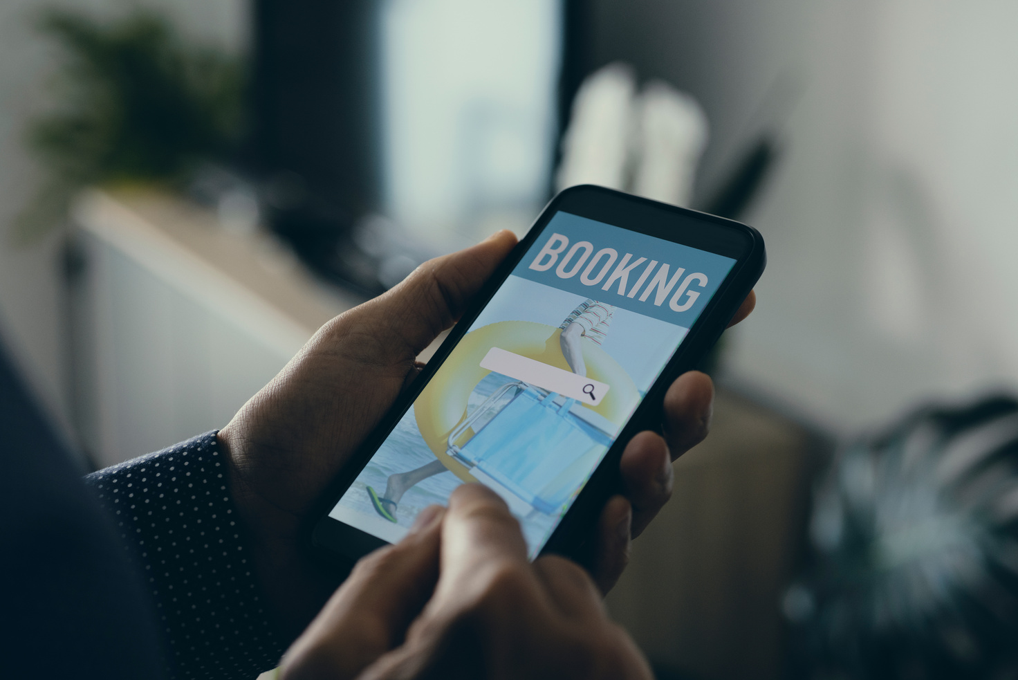 Person Booking a Hotel Online with a Smartphone